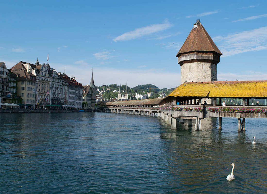 Lucerne: The Wasserturm and Kapellbrucke from the Bahnhofstrasse, looking to the Hofkirche.  Photograph by David Hill, 26 May 2014, 18.25  The Hofkirche only becomes visible near the Jesuitenkirche, and is not actually visible from the Reussbrucke. Click on image to enlarge