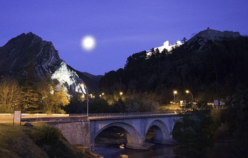 Sisteron by Moonlight: Looking over the Pont du Buech to the Citadel and the Rocher de la Baume Photograph by David Hill. Click to enlarge and then 'back' to return to this page.