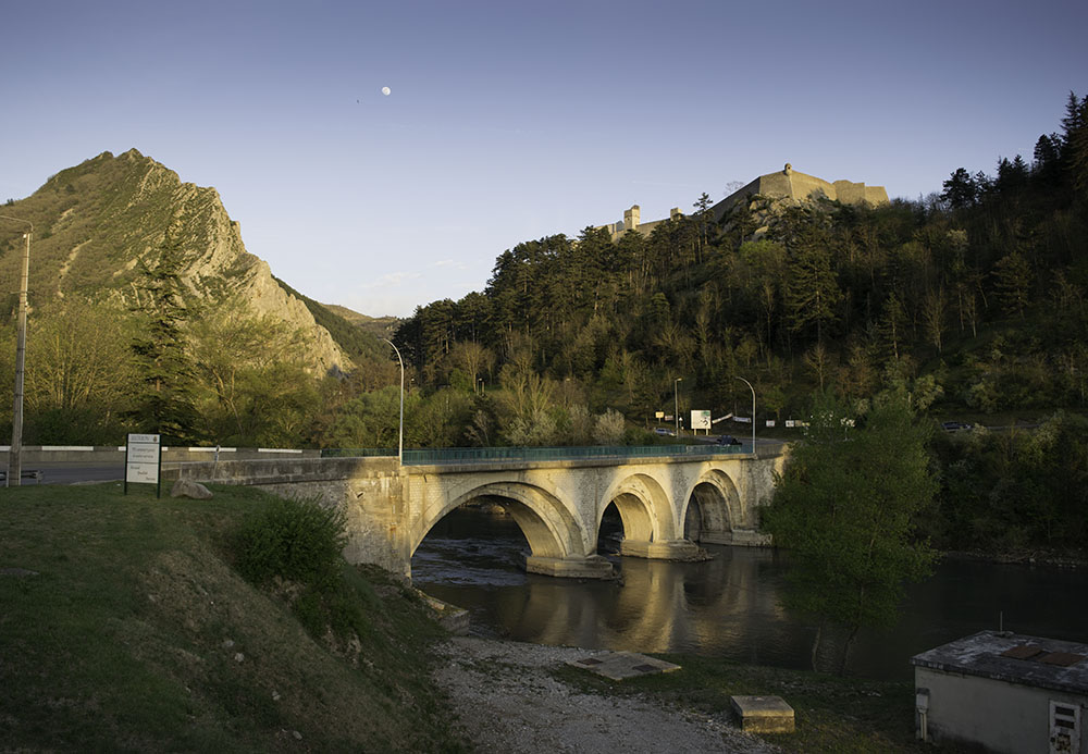 Moonrise, Sisteron. Looking over the Pont du Buech with the shadow of the citadel visible on the Rocher de la Baume. Photograph by David Hill, 12 April 2014, 19.47.06 Click on image to enlarge; use 'back' button to return